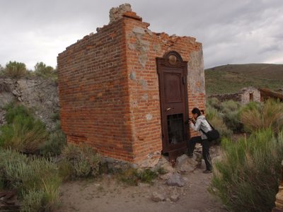 Monica photographing the ruins of the bank.