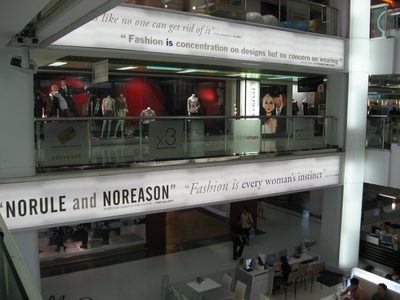 Inscrutable advertisements in the Paragon Mall in Bangkok.