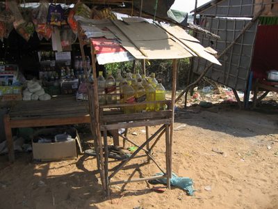 Cambodian gas station:  1 liter of gasoline costs $1 US,...