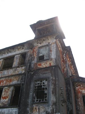 Bokor Hill Casino tower with sunlight behind it.