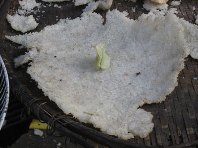 Close up of crunchy rice drying on a table on a sidewalk...