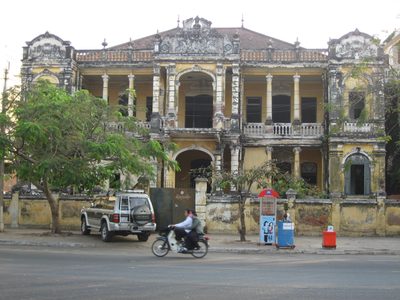 A really cool acid-washed French colonial building in...