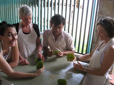 Folding our banana leaves into bowls with the help of...