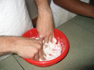 Kneading the glutenous rice flour and water into dough.