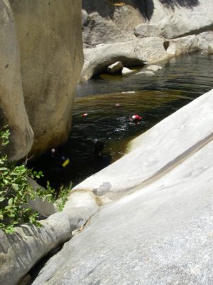 John, pushing his backpack along the river.  As it turns...