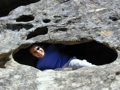 John hanging out in a swiss-cheese rock cave.