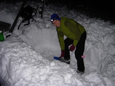 John, digging a sleeping pit.