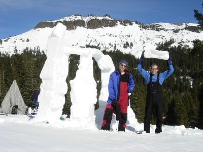 David and John with Snowhenge.  John holding a snow-brick.