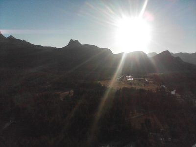 Holy Cathedral Peak, silhouetted against the sun.