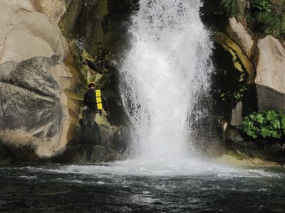 Yang, rappelling next to the falls.