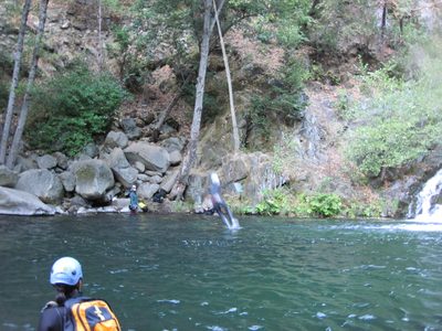 Vinnie jumping off a rope swing.