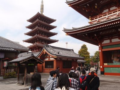 Part of the Asakusa temple complex. The wooden statue at...