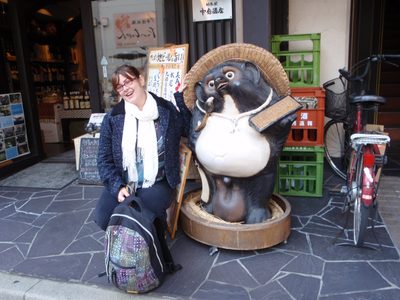 Cass posses with a carved woodland critter.