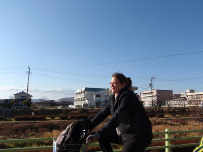 Cass, riding along side the river through Matsumoto.