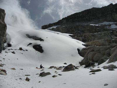 The beginning of glacier. Rodrigo sits down for a snack,...