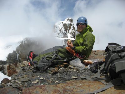 John eating lunch on the summit, with a false summit of...