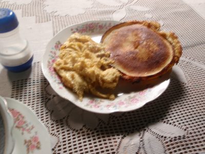 A blurry shot of my breakfast: some eggs and a corn...