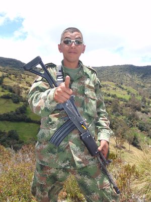 A soldier posing wearing my sunglasses.