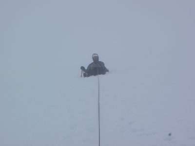 My guide keeping the rope tight as I cross a crevasse on...