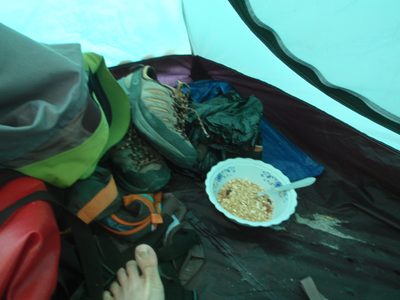 Eating breakfast at 5am in the tent.  It had poured rain...