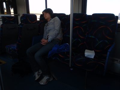 Monica sleeps on the bus.