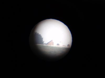 Taking a photo of Monserrate through the telescope.