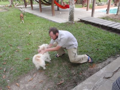 Joel plays with one of the dogs at our hostel. 