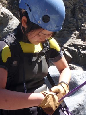 Monica rigging herself in for the second rappel.