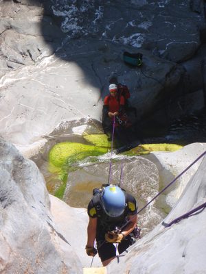 Monica on rappel, while John gives a fireman's belay...