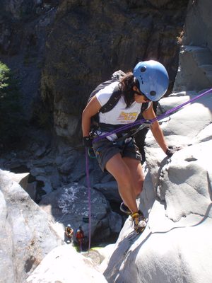 Christina, balancing herself on the second rappel.