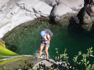 Christina, standing at the edge of the waterfall.