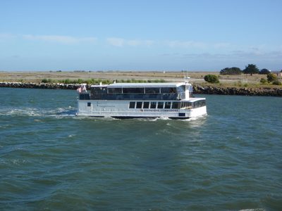 Entering Oakland Harbor. The decommissioned Alameda...
