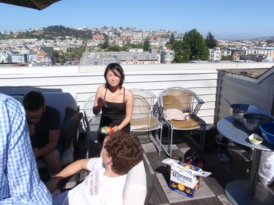 Monica at our first barbecue of the season on our roof...