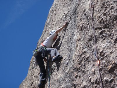 Dong lead climbing a 5.8 route at Chipmunk Flat along...