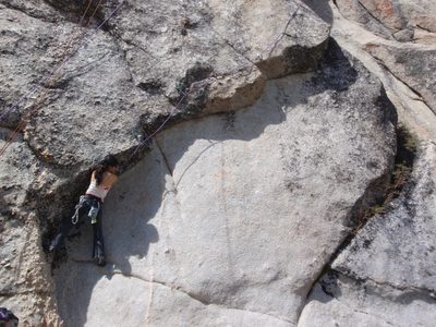 Dong climbing the 5.10c after I led it. Since it's a...