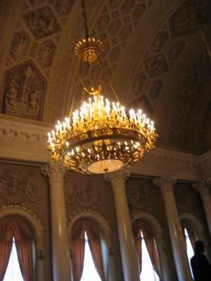 A chandelier that looks like it is made out of gilded...
