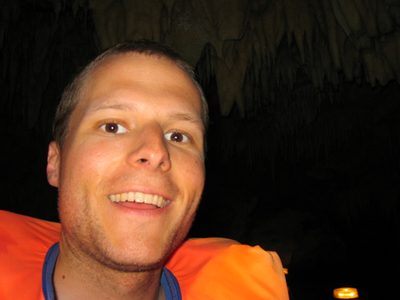 John, excited to be taking a boat tour through a seaside cave.
