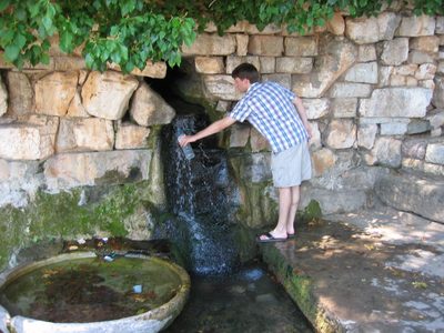 Nick, getting a drink at the village well.