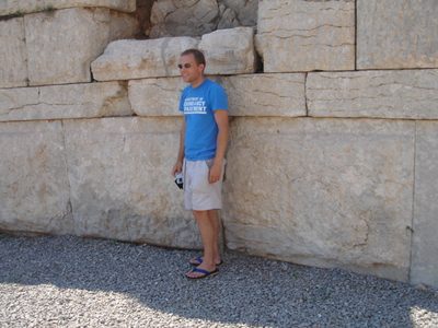 John staying out of the sun at one of the large gates at Messene.