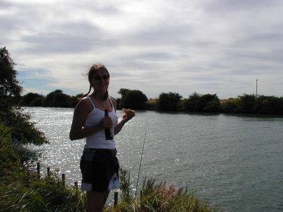 Stephanie, eating lunch and waiting for the fish to bite.