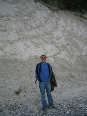 John on the stone beach at the foot of the cliffs, right...