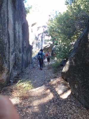 Marching down through some boulders.