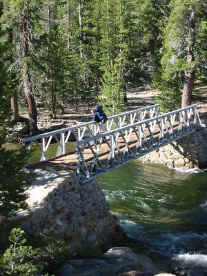 John on the bridge over the Tuolumne River next to the...