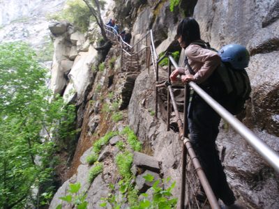 Monica climbs the steps cut into the cliff band of Vernal Falls.