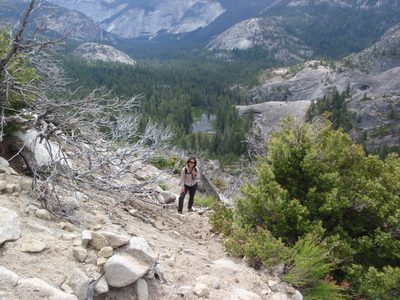 Monica climbing the sandy switchbacks to the base of the climb.