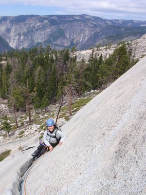 Monica nearing the top of pitch 1 on Snake Dike, with...