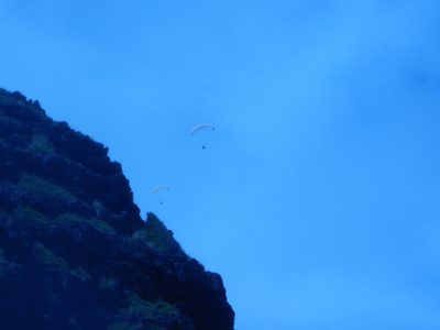 Hang gliding off the side of nearby mountain and riding...