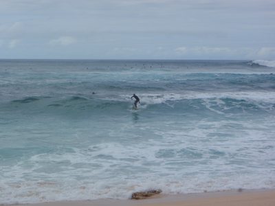 A surfer headed back for shore.