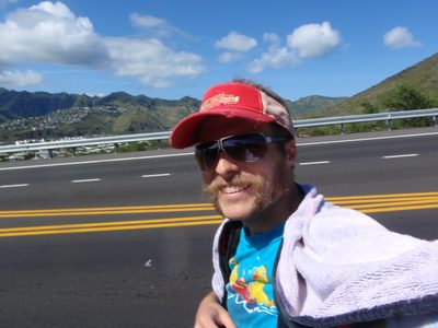 Using my towel and a shawl to ward off a sunburn, I...