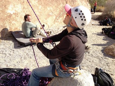 John, belaying from a rock while Jim puts on some shoes...
